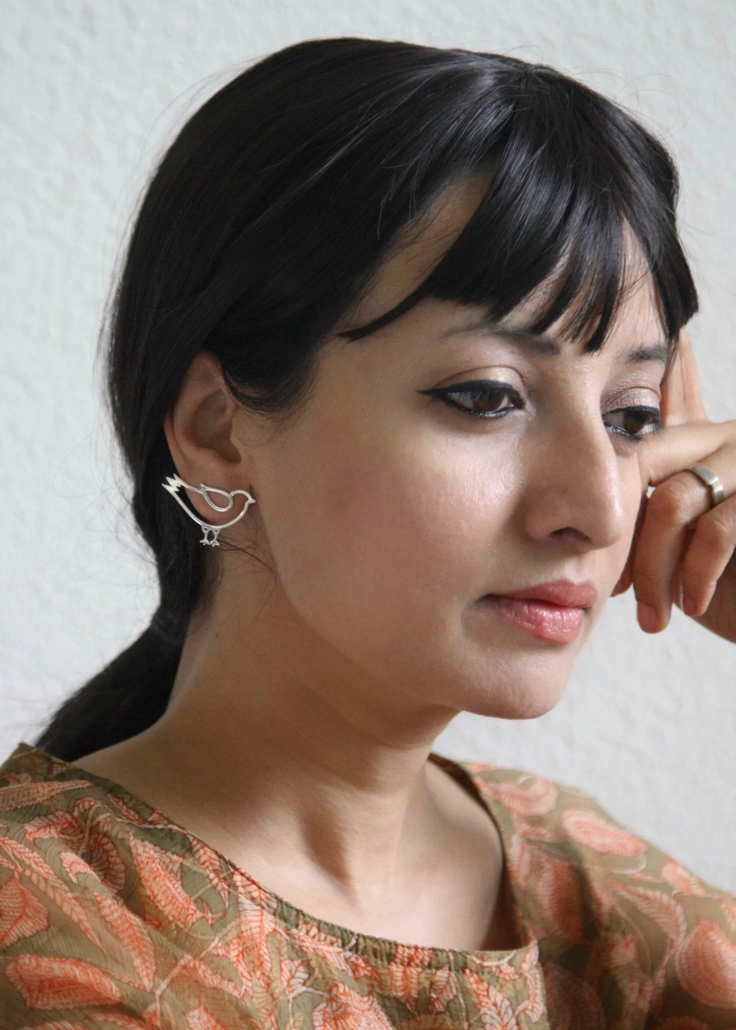 Whimsical, asymmetrical 'paksi' (bird) earrings