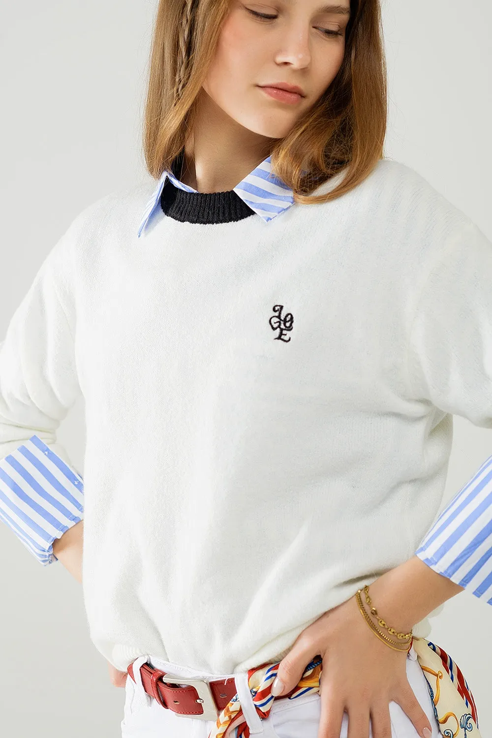 White sweater with contrasting collar and love logo on chest