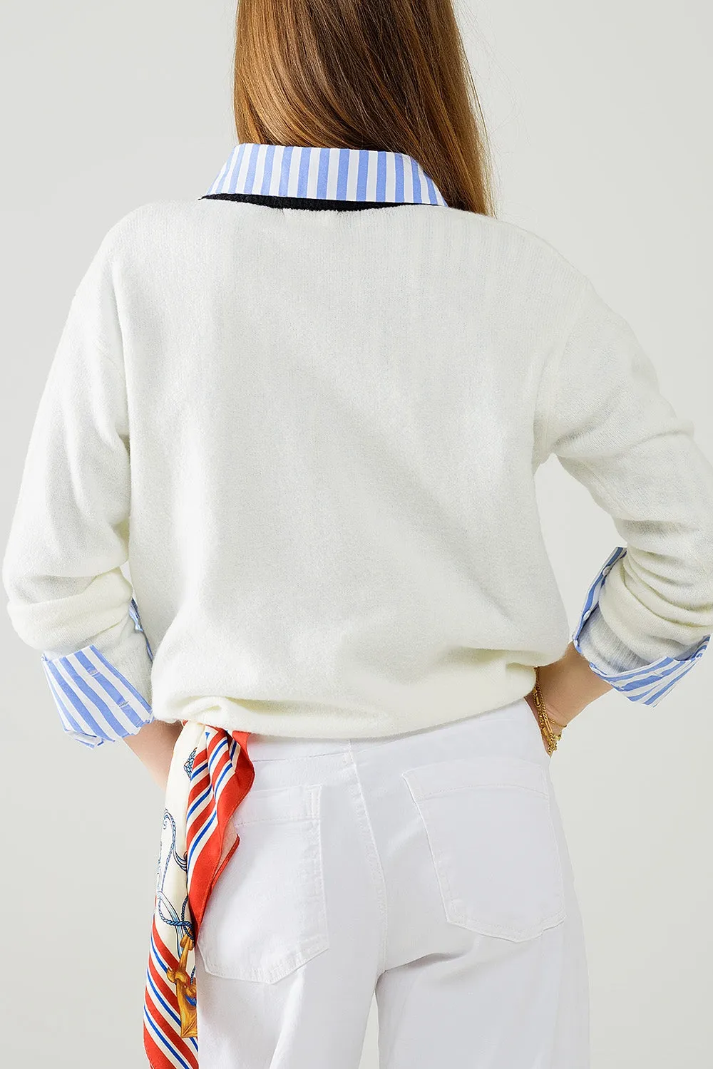 White sweater with contrasting collar and love logo on chest